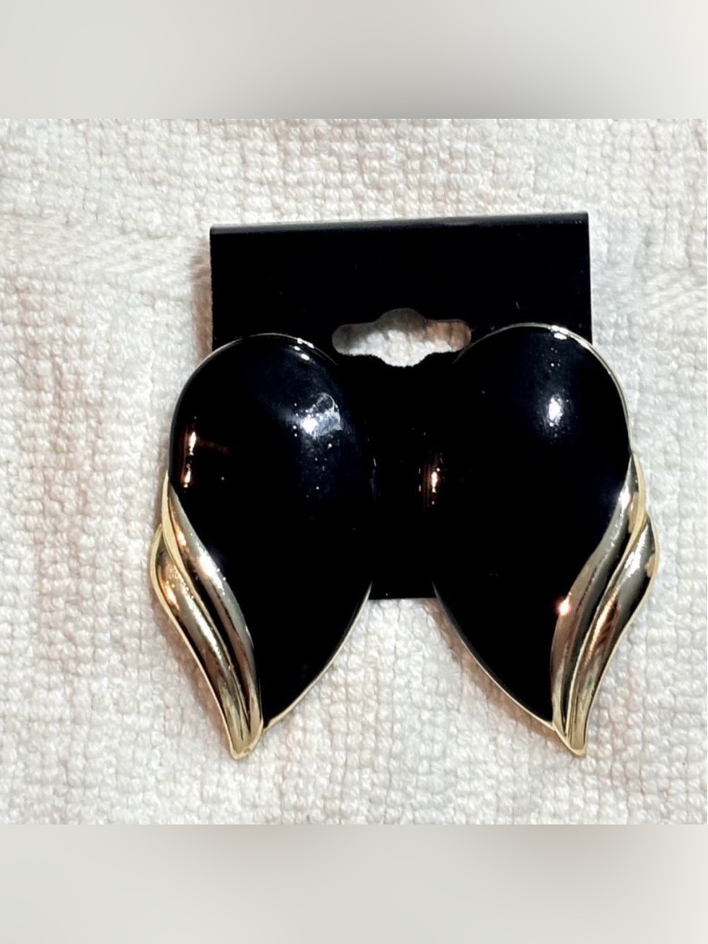 Pair of Large Teardrop Black Earrings With Gold Tone Edging